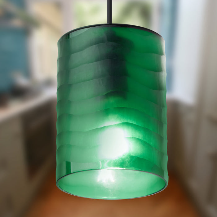 5" W Elowen Mid-Century Modern Green Cylinder Hand Blown Glass Shade Pendant Light hanging in a blurred indoor setting