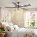 52"W LED Roxsie 5-Blade Crystal LED Chandelier Ceiling Fan in a bedroom with floral bedding and window view.