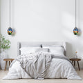 5.5" W Bouvier Metal and Glass Pendant Light in a modern bedroom with a bed andside tables