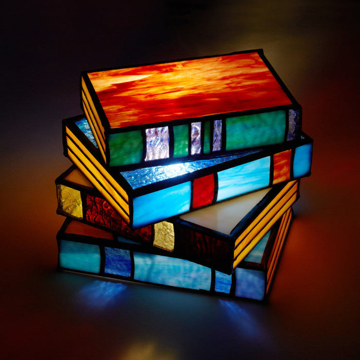5.75" H Multi-Colored Book Stack Stained Glass Accent Lamp lit up at night
