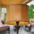 59.5"H Outdoor and Indoor Basket Weave Floor Lamp on a blurred outdoor background