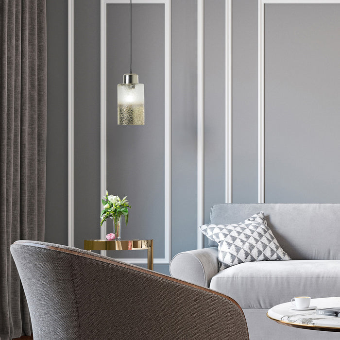 6" Callie Silver Finish Textured Metallic Gold and Clear Ombre Glass Cylinder-Shaped Pendant Lamp in a modern living room with gray sofa, armchair, and striped wall.