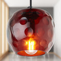 6" W Anthony Retro Red Hand-Blown Glass Globe Shade Pendant Light with Hand Cut Polka Dot Design in a room setting