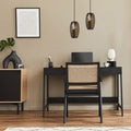 6" W Austin Glam Black and Amber Glass Globe Shade Pendant Light hanging above a modern office setup with black desk and chair