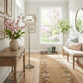 62" H Veronica Aged Silver-Finish Metal Floor Lamp in a living room with floral arrangement and a bench