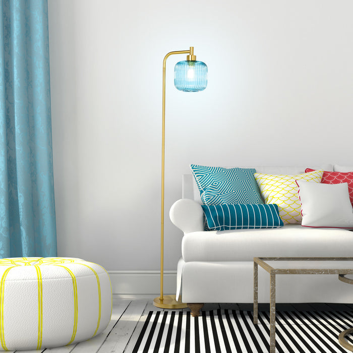 63"H Rowan Globe Shade Floor Lamp in a modern living room with a white sofa, colorful pillows, and a striped rug.