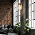 6.5" 1-Light Gold Pendant Light with Textured Glass Brown Mango Wood and Amber Glass Cylinder Shade in a modern living room with brick wall and large windows
