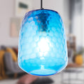 7" W Payton Retro Blue Hand Blown Glass Globe Shade Pendant Light with Hand Cut Honeycomb Design in a blurred indoor setting