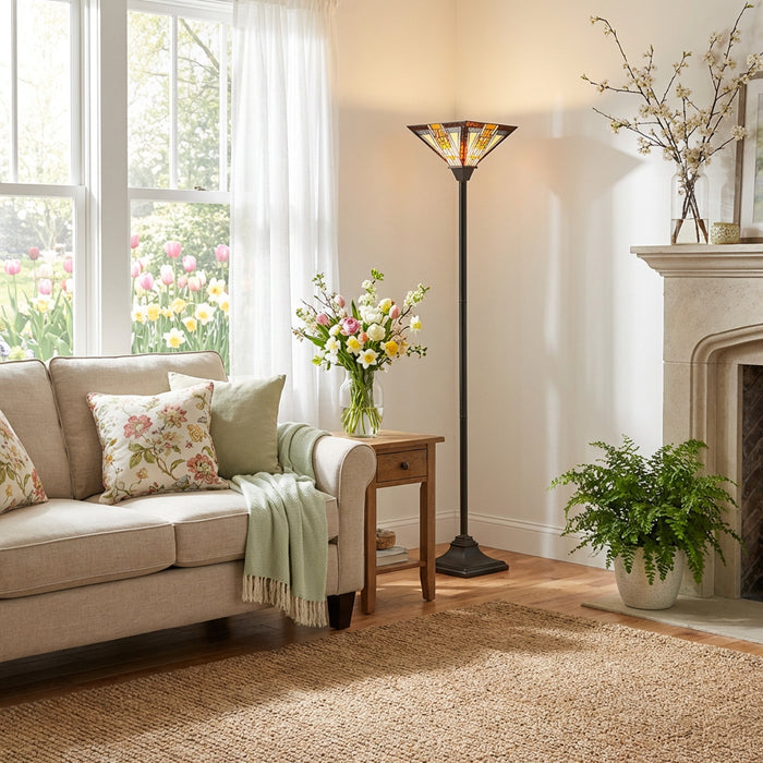 71"H Stained Glass Mission Style Southwestern Torchiere in a living room with beige sofa and decorative pillows.