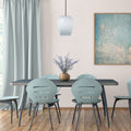 7.8" W Ellison Glam Blue and White Glass Globe Shade Pendant Light hanging in a dining room with a table and chairs, decorative vase, and wall art.