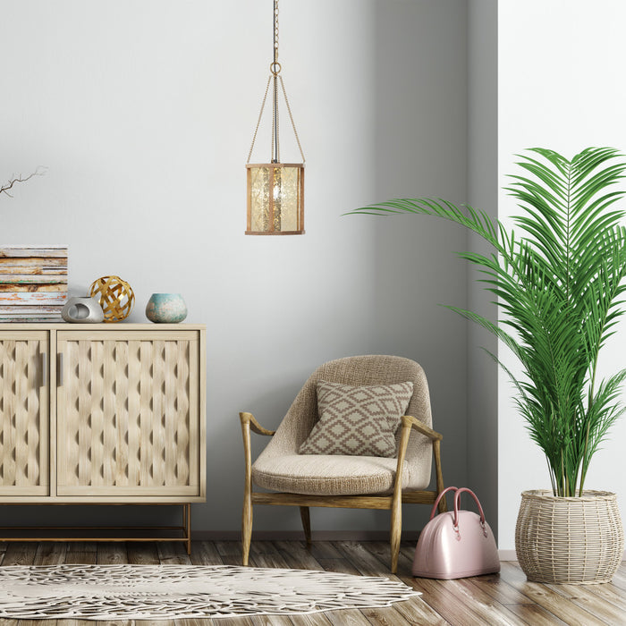 9-in. 1-Light Pendant Light with Painted Gold Mercury Glass and Wood Shade in a modern living room with a beige armchair, sideboard, and plant.