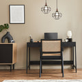 9" W Bettany Bohemian Clear Globe Shade Pendant Light in a modern office setup with a black desk, chair, and decorative items.