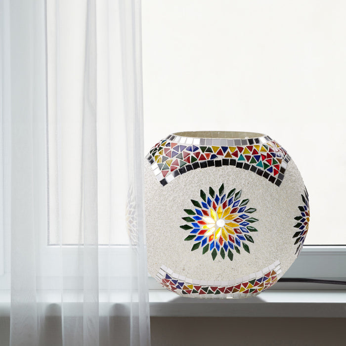 9.5" H Juliette Multicolor Globe Shade Mosaic Glass Accent Lamp on a window sill with sheer drapes