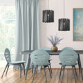 9.75" W 1-Light Westley Black Metal Pendant in a dining room with a table and chairs near a window with light blue curtains.