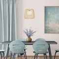 9.875"W Lucai Caged Globe Shade Pendant Light in a dining room with a table and chairs and wall art.