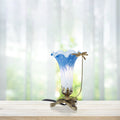 9"H Handpainted Glass Dragonfly Lily Lamp on a wooden surface with a blurred natural background