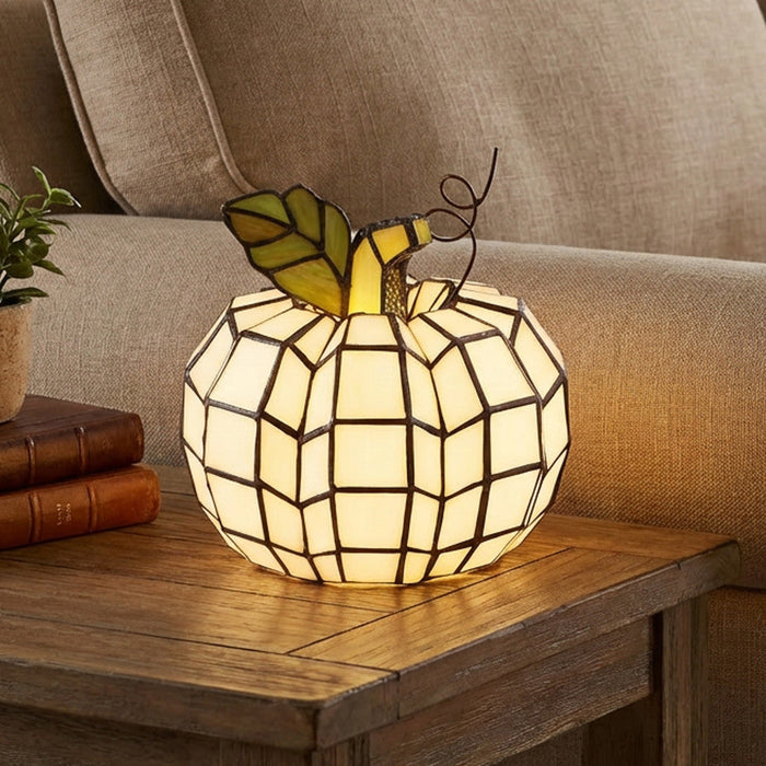 9"H Patch the Pumpkin Stained Glass Accent Lamp on a wooden table