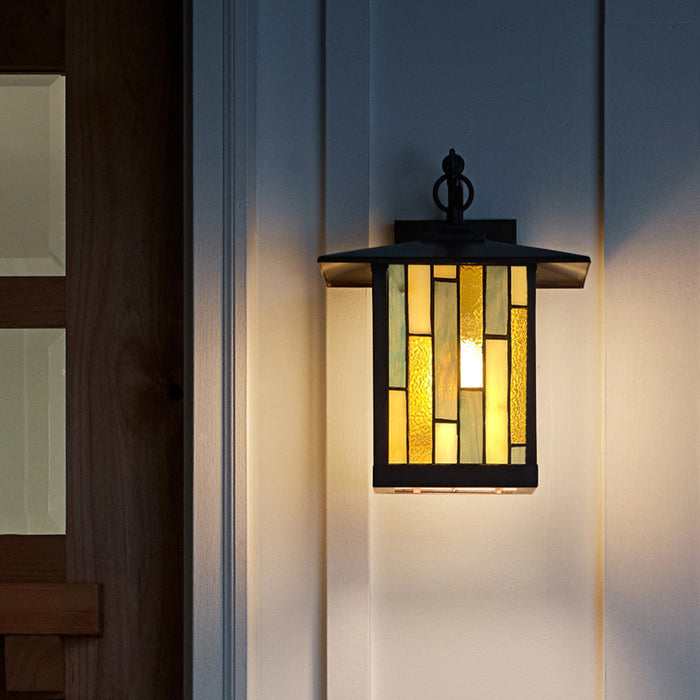 Amber Stained Glass and Oil Rubbed Bronze 1-Light Outdoor Lantern Wall Sconce mounted next to the front door of a house