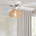 Avalon White and Tan Wood Caged Ceiling Fan with Light in a room with curtains and a window.