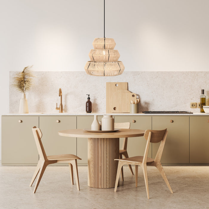 Brigitta 20"W Tiered Cream Jute Pendant Light in a modern kitchen with a round wooden dining table and chairs and neutral color scheme.