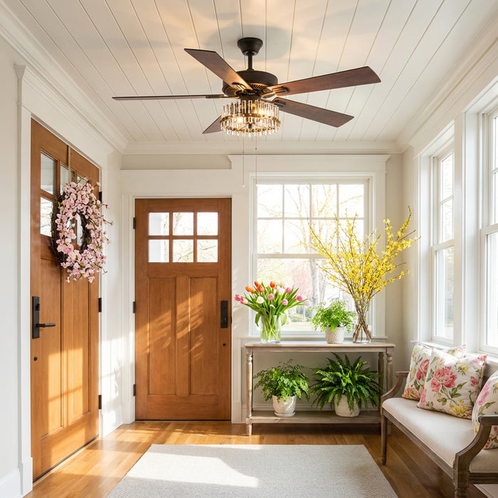 Carrie River of Goods Oil-Rubbed Bronze Metal 2-Light 52-Inch Ceiling Fan in a foyer with wooden doors and decorative elements.