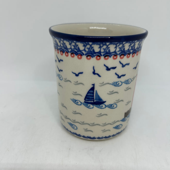 Side view of a large 16oz Ceramika Artystyczna Polish pottery B13 mug in the Unikat U5164 pattern, featuring a blue sailboat, waves, straight sides, and the blue rim.