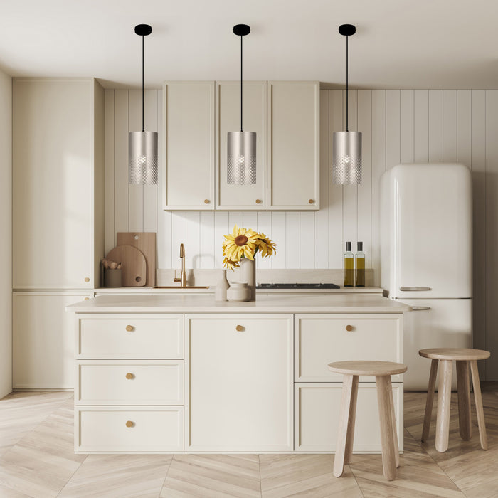 Fatima 8"W Silver Cutout Drum Pendant Lights in a modern kitchen with light wood cabinets, white refrigerator, and wooden stools.