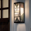 Grey Stained Glass and Black Satin Rectangular 1-Light Outdoor Wall Sconce mounted next to a front door to a house