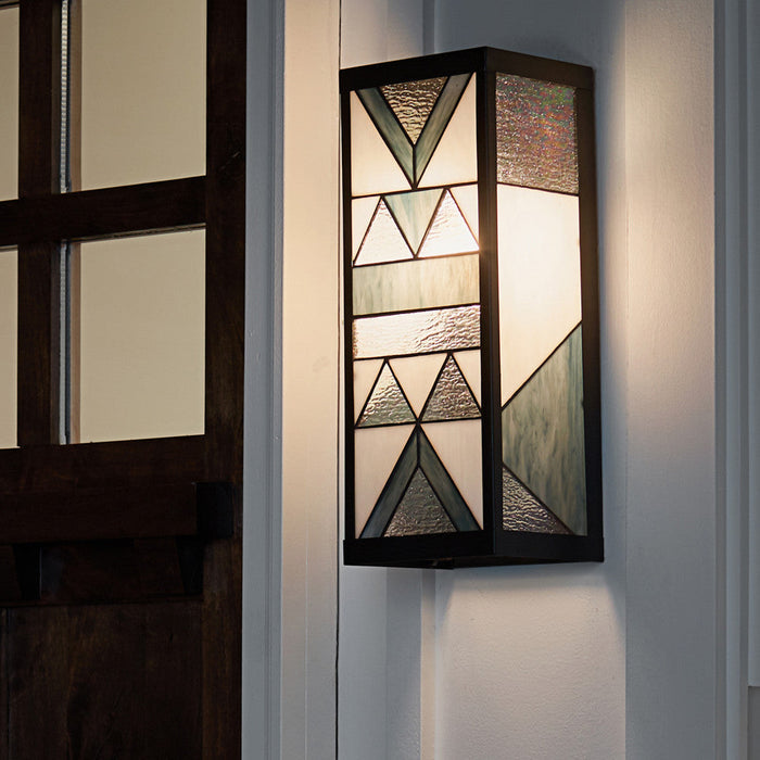 Grey Stained Glass and Black Satin Rectangular 1-Light Outdoor Wall Sconce mounted next to a front door to a house