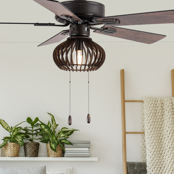 Leigh Brown Oil-Rubbed Bronze and Wood Caged Ceiling Fan with Light in a room with plants and a ladder shelf