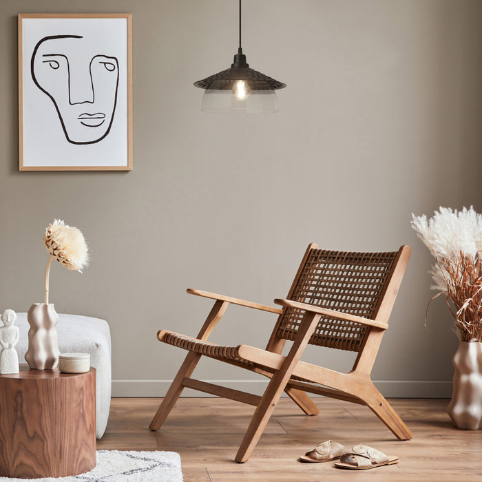 Leslie 11.8" Black Satin Painted Cone-Shaped Pendant Lamp in a modern living room with wooden armchair, decorative vases, and abstract art on the wall.