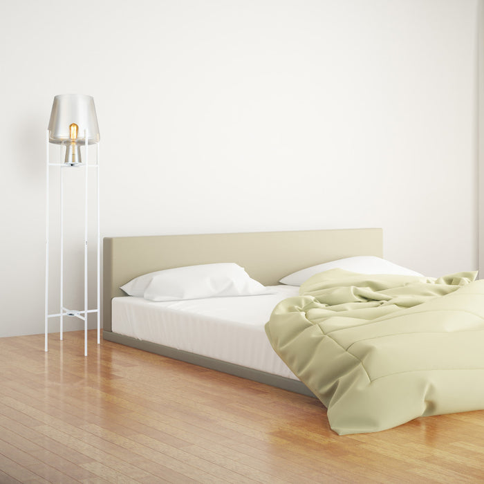 Leticia White Metal and Champagne Gold Glass Bowl 61-Inch Floor Lamp in a bedroom with a bed and light-colored walls