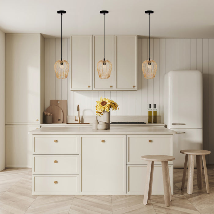 Lucinda 7.25"W Modern Gold Woven Metal Pendant Light hanging in modern kitchen with light wood cabinets, white refrigerator, and decorative elements.