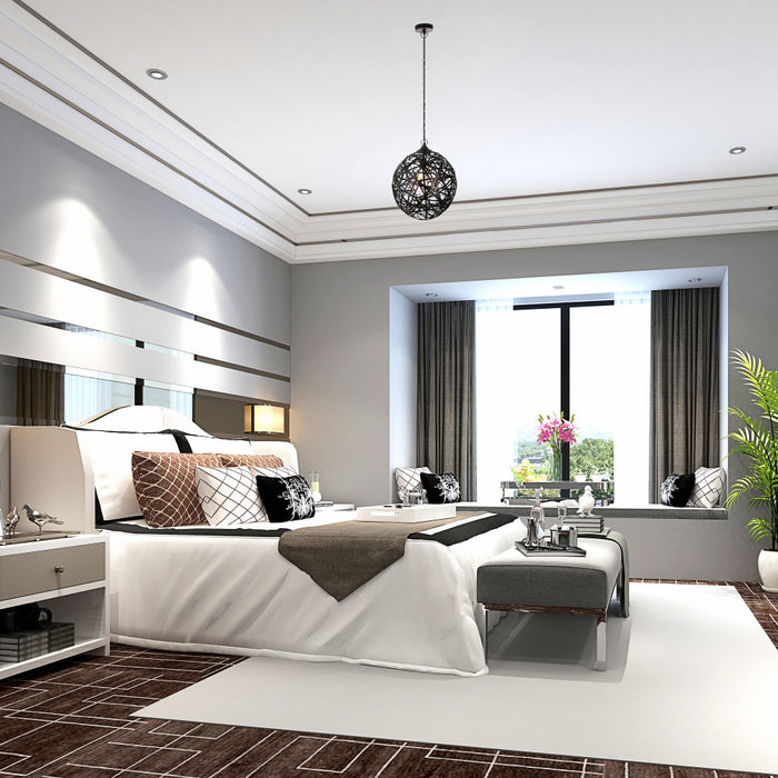 Magnolia 16.25"W Modern Black Abstract Globe Metal Pendant Light in a modern bedroom with a large bed, decorative pillows, and a large window.