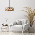 Morel Brown Mango Wood and Metal Pendant Light in a modern living room with a white armchair, wooden side table, and decorative plant.