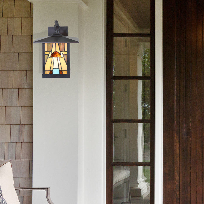 Natural Stained Glass and Oil Rubbed Bronze 1-Light Outdoor Lantern Wall Sconce on a house exterior.
