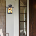 Natural Stained Glass and Oil Rubbed Bronze 1-Light Outdoor Lantern Wall Sconce on a house exterior.