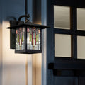 Red Stained Glass and Black 1-Light Outdoor Lantern Wall Sconce on a building exterior.