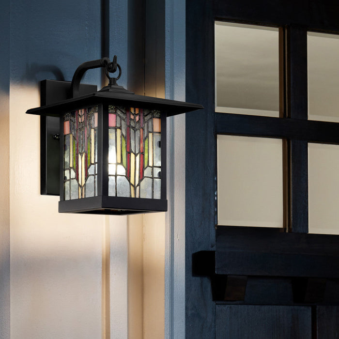 Red Stained Glass and Black 1-Light Outdoor Lantern Wall Sconce on a building exterior.