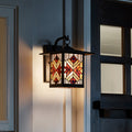 Red Stained Glass and Oil Rubbed Bronze 1-Light Outdoor Lantern Wall Sconce on a building exterior.