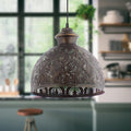 Sigrid Antique Bronze Metal Bowl-Shade Pendant Lamp hanging in a room with a window and shelves in the background