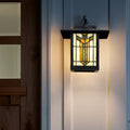Amber Stained Glass and Black 1-Light Outdoor Lantern Wall Sconce mounted next to a front door.