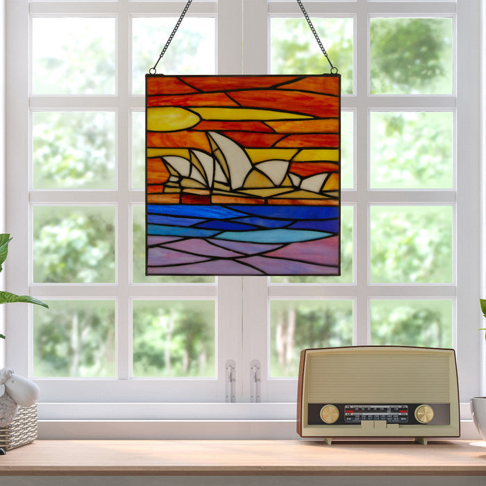Sydney Opera House Stained Glass Window Panel hanging in front of a window with a vintage radio on a windowsill.